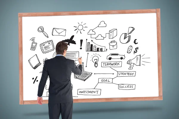 Businessman standing back to camera writing — Stock Photo, Image