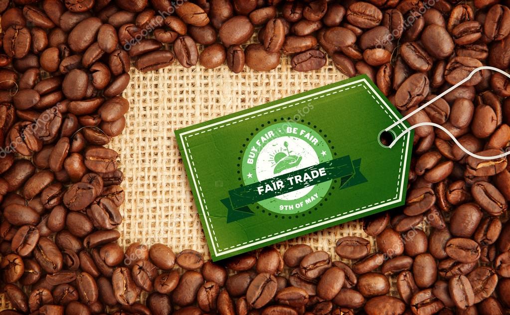 Fair Trade graphic against coffee beans with rectangular indent for copy space