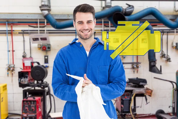 Male mechanic wiping hands with cloth — Stock Photo, Image