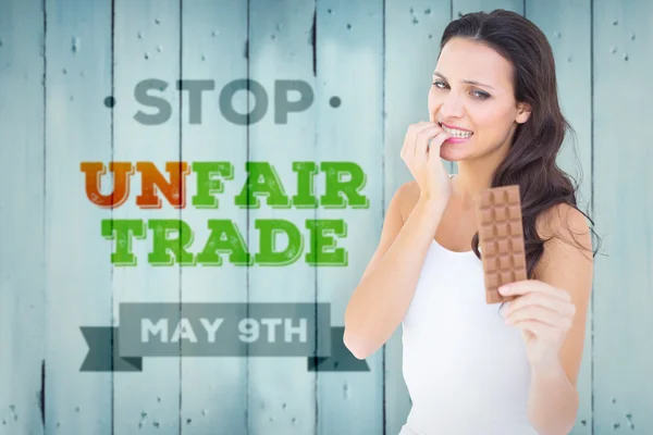 Pretty brunette fearfully looking at chocolat — Stock Photo, Image