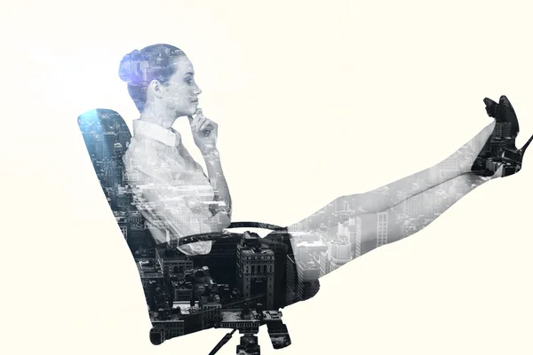 Businesswoman sitting on swivel chair — Stock Photo, Image