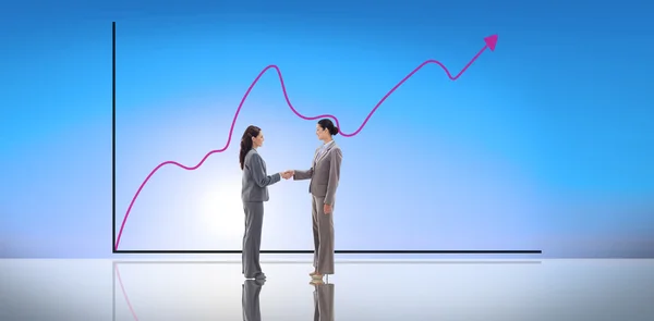 Composite image of businesswomen shaking hands — 图库照片