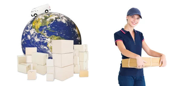 Happy delivery woman holding cardboard box — Stok Foto