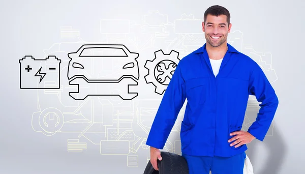 Mechanic holding tire — Stock Photo, Image