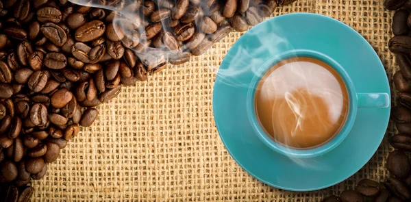Imagem composta de xícara azul de café — Fotografia de Stock