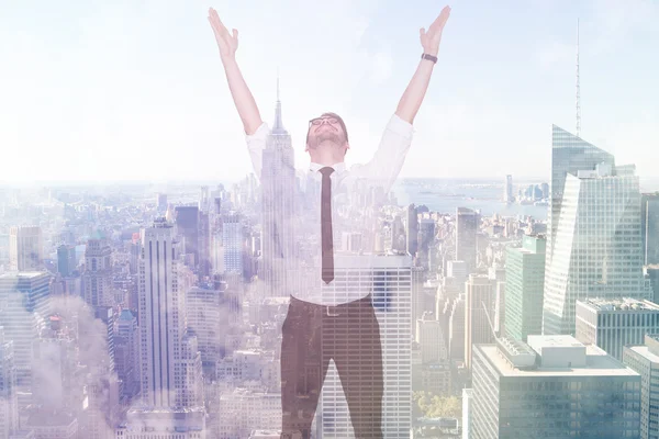 Smiling businessman cheering with his hands up — Stock Photo, Image