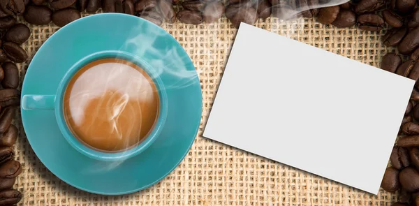 Composite image of blue cup of coffee — Stock Photo, Image