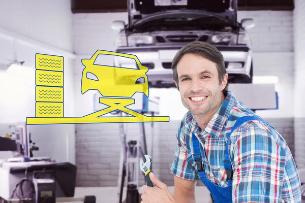 Confident plumber holding adjustable wrench — Stock Photo, Image