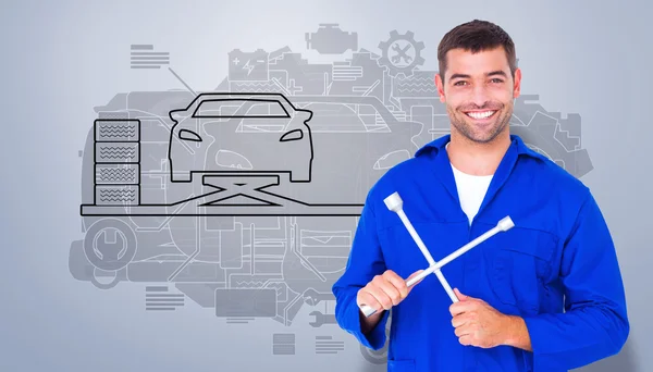 Male mechanic holding lug wrench — Stock Photo, Image