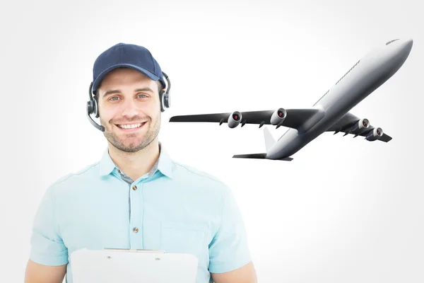 Happy male courier man wearing headset — Stockfoto
