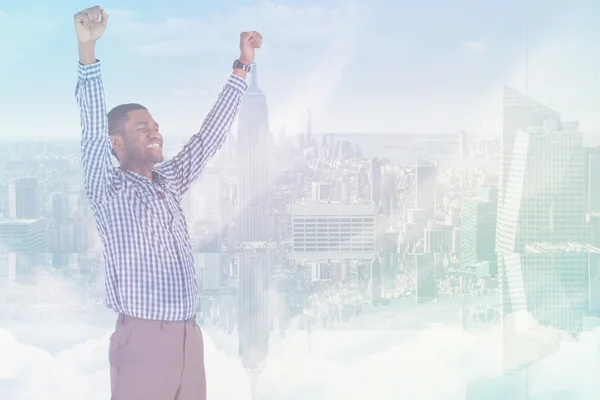 Composite image of excited businessman cheering — Stock Photo, Image