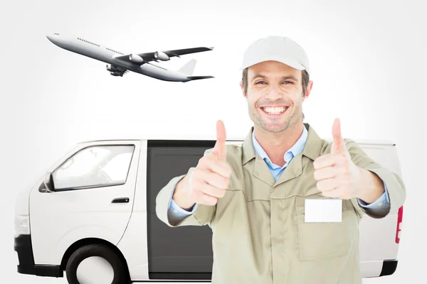 Happy delivery man gesturing thumbs up — Stock Photo, Image