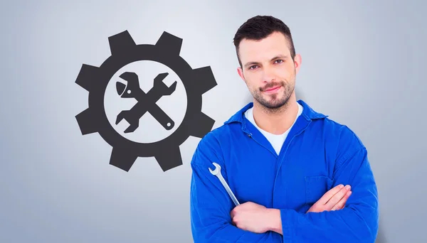 Mechanic holding spanner — Stock Photo, Image