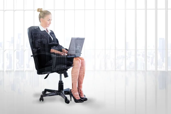 Businesswoman sitting on swivel chair with laptop — Stock Photo, Image