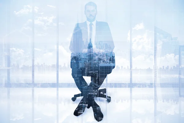 Stern businessman sitting on an office chair — Stock Photo, Image