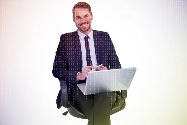 Happy businessman with laptop using smartphone — Stock Photo, Image