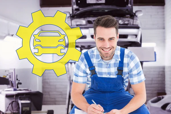 Happy repairman crouching — Stockfoto