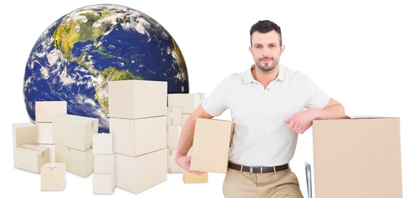 Immagine composita di uomo di consegna con carrello di scatole — Foto Stock