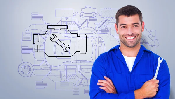 Mechanic holding spanner — Stock Photo, Image