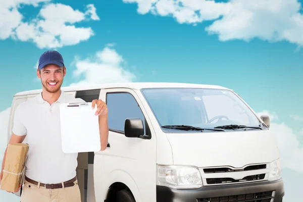 Happy delivery man holding cardboard box — Stock Photo, Image