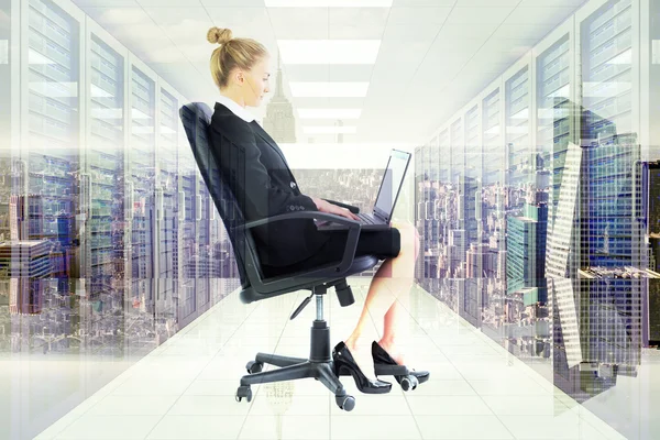 Businesswoman sitting on swivel chair — Stock Photo, Image