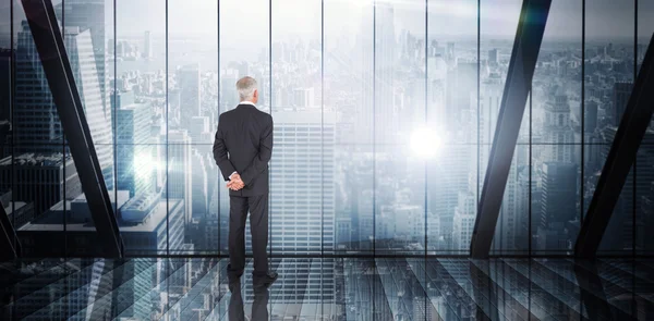 Composite image of businessman standing — Stock Photo, Image