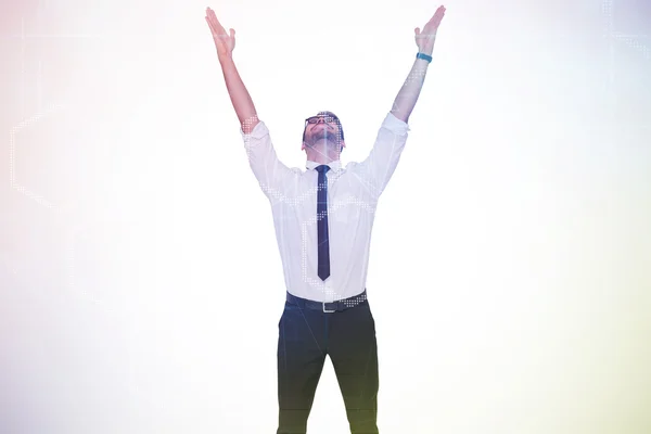 Smiling businessman cheering with his hands up — Stock Photo, Image