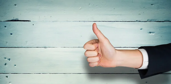 Composite image of hand showing thumbs up — Stock Photo, Image