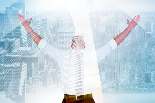 Handsome businessman cheering with arms up — Stock Photo, Image