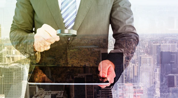 Businessman scrolling on his digital tablet — Stock Photo, Image