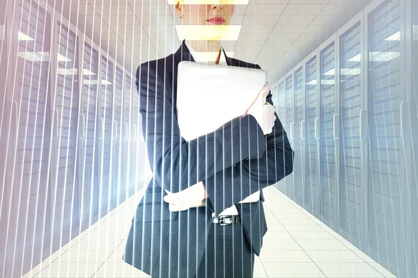 Composite image of businesswoman holding laptop — Stock Photo, Image