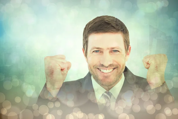Businessman smiling and cheering — Stock Photo, Image
