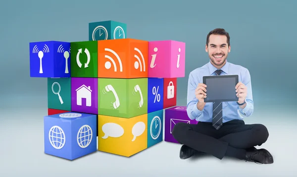 Businessman showing his digital tablet — Stock Photo, Image