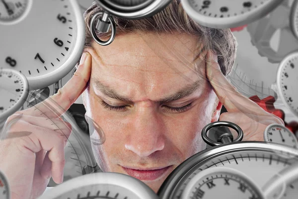 Composite image of businessman with a headache — Stock Photo, Image