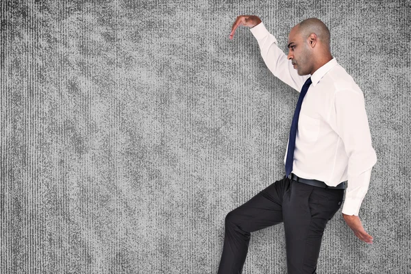 Composite image of businessman stepping — Stock Photo, Image
