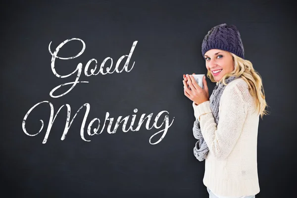 Pretty blonde in winter fashion holding mug — Stock Photo, Image