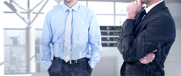 Composite image of frowning businessman thinking — Stock Photo, Image