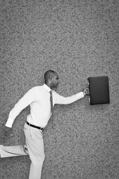 Imagem composta do homem de negócios correndo com pasta — Fotografia de Stock