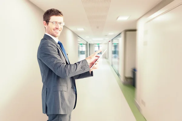 Businessman using his tablet pc — Stock Photo, Image