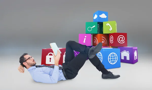 Businessman lying on floor while reading — Stock Photo, Image