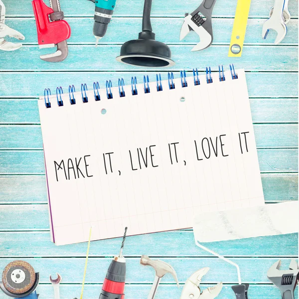 Make it, live it, love it against tools and notepad on wooden ba — Stock Photo, Image
