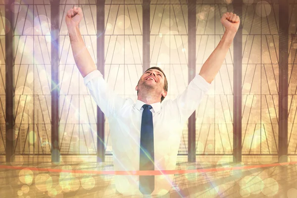 Composite image of businessman crossing the finish line — Stock Photo, Image