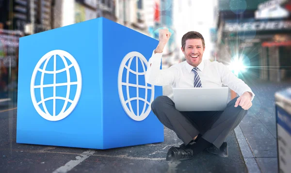 Businessman using laptop and cheering — Stock Photo, Image