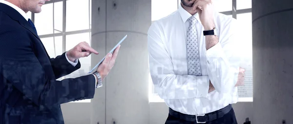 Composite image of portrait of a businessman with glasses thinki — Stock Photo, Image