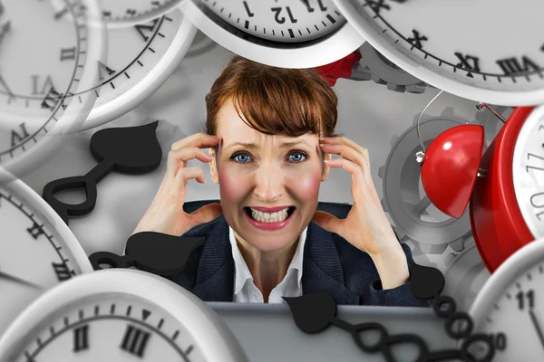 Composite image of stressed businesswoman — Stock Photo, Image