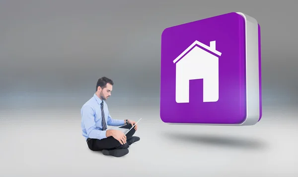 Businessman sitting on floor using laptop — Stock Photo, Image