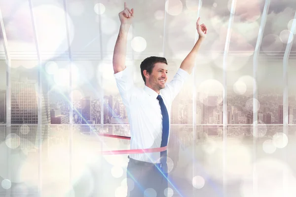 Composite image of businessman crossing the finish line — Stock Photo, Image