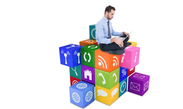 Businessman sitting on floor using laptop — Stock Photo, Image