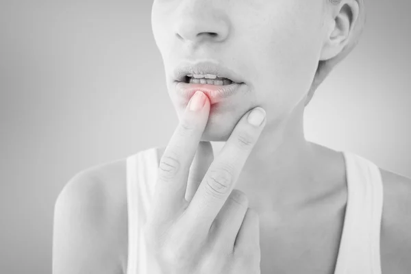 Thoughtful woman touching her lips — Stock Photo, Image