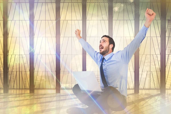 Excited cheering businessman sitting — Stock Photo, Image